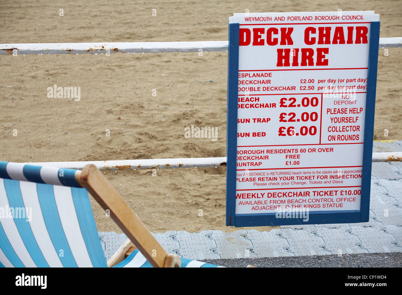 Deck chair hire charges at Weymouth beach in April Stock Photo