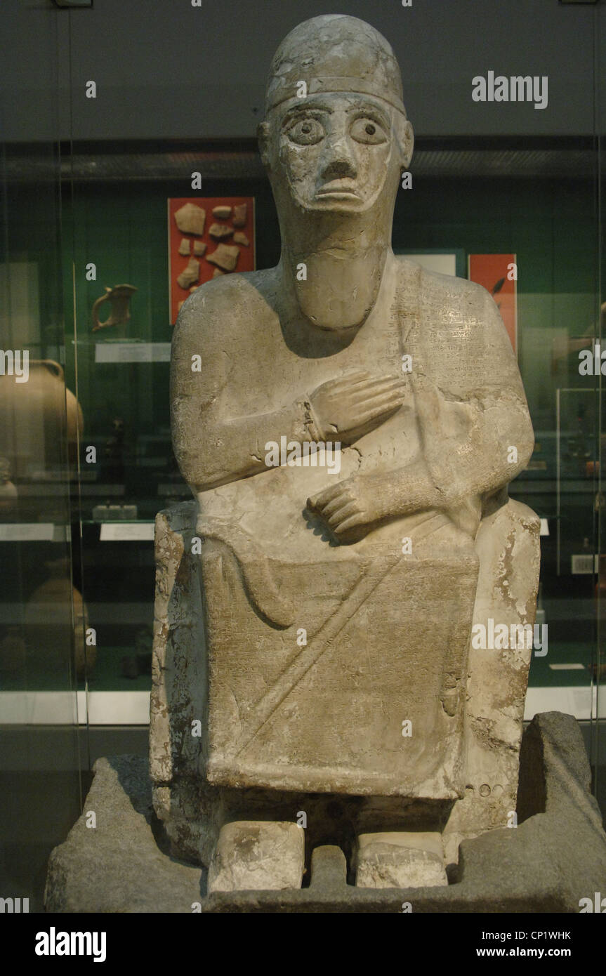 Stone statue of King Idrimi of Alalakh seated in his throne. 1570-1500 BC. British Museum. London. United Kingdom. Stock Photo
