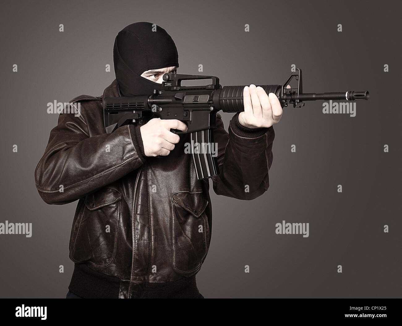 portrait of terrorist with automatic rifle Stock Photo