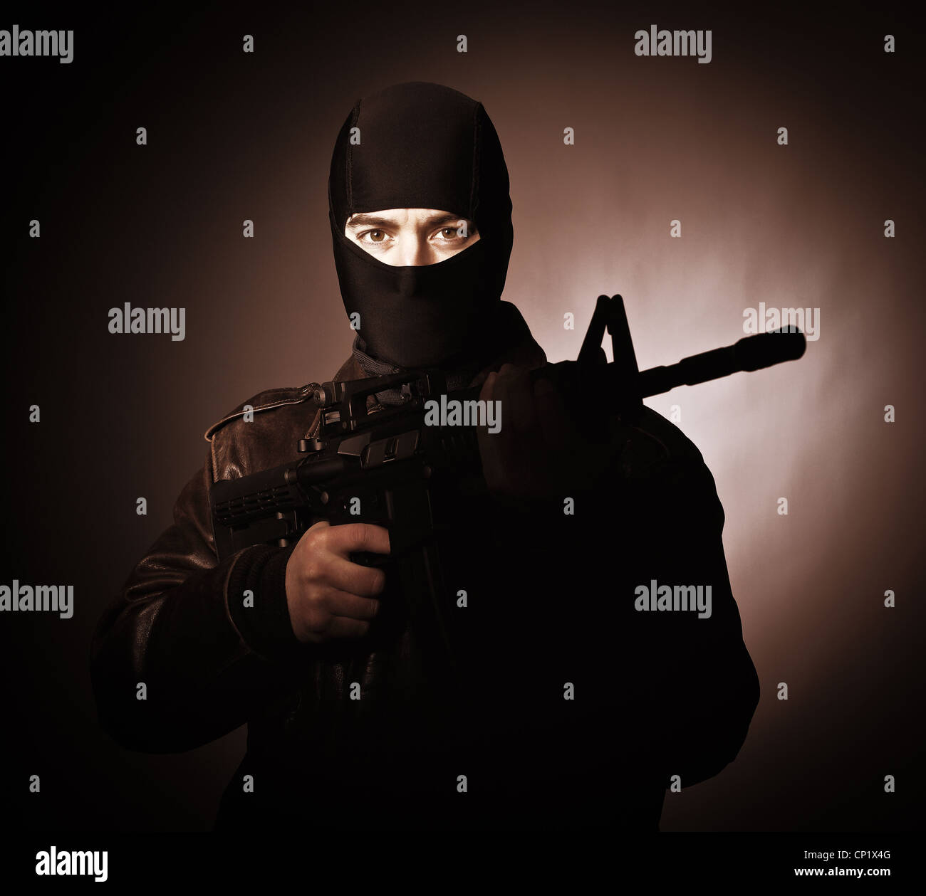 portrait of terrorist with automatic rifle Stock Photo