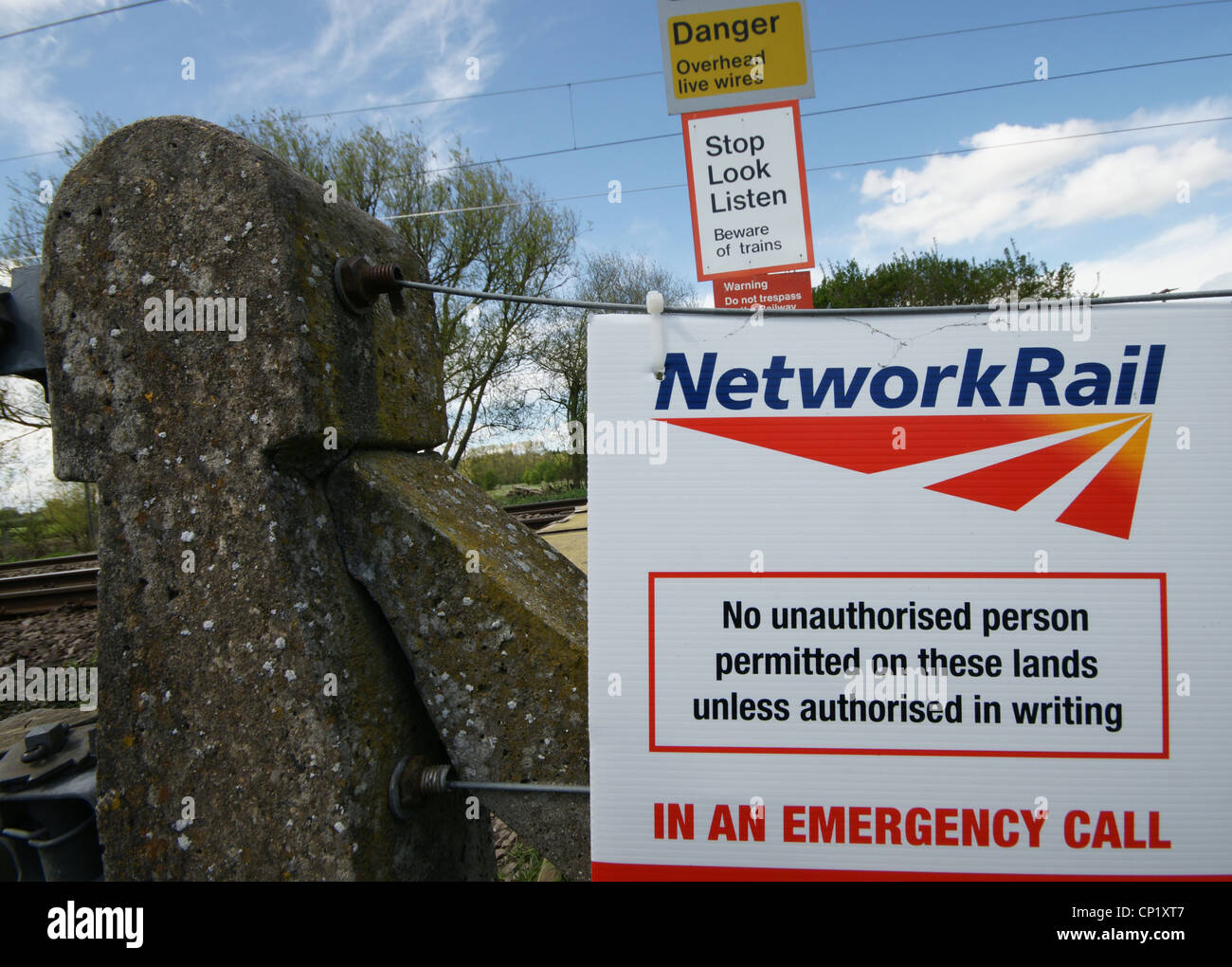 Signs on a railway line in Hertfordshire warning of measures in place to combat cable and metal theft Stock Photo