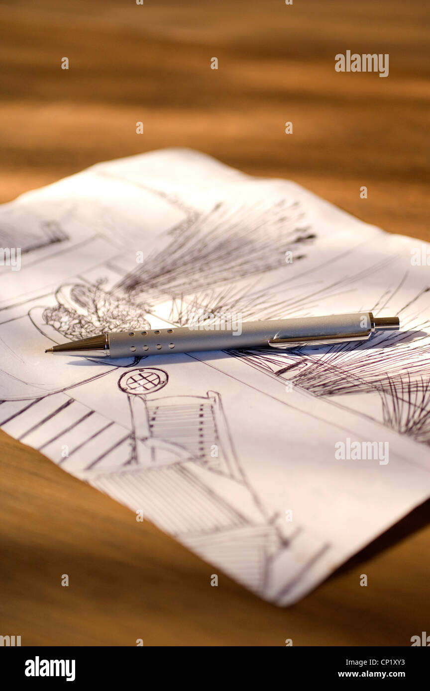 Sketch paper with pen on desk Stock Photo - Alamy