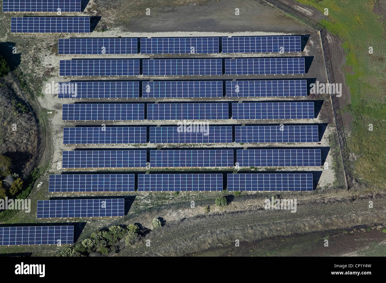 aerial photograph rows of solar panels at wetland restoration project Stock Photo