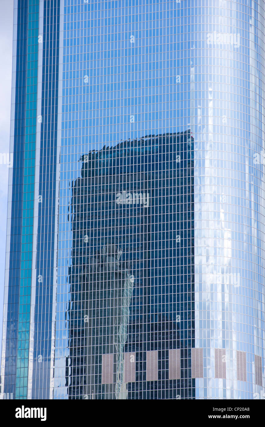 skyscraper and reflections on glass exterior in downtown los angeles california Stock Photo