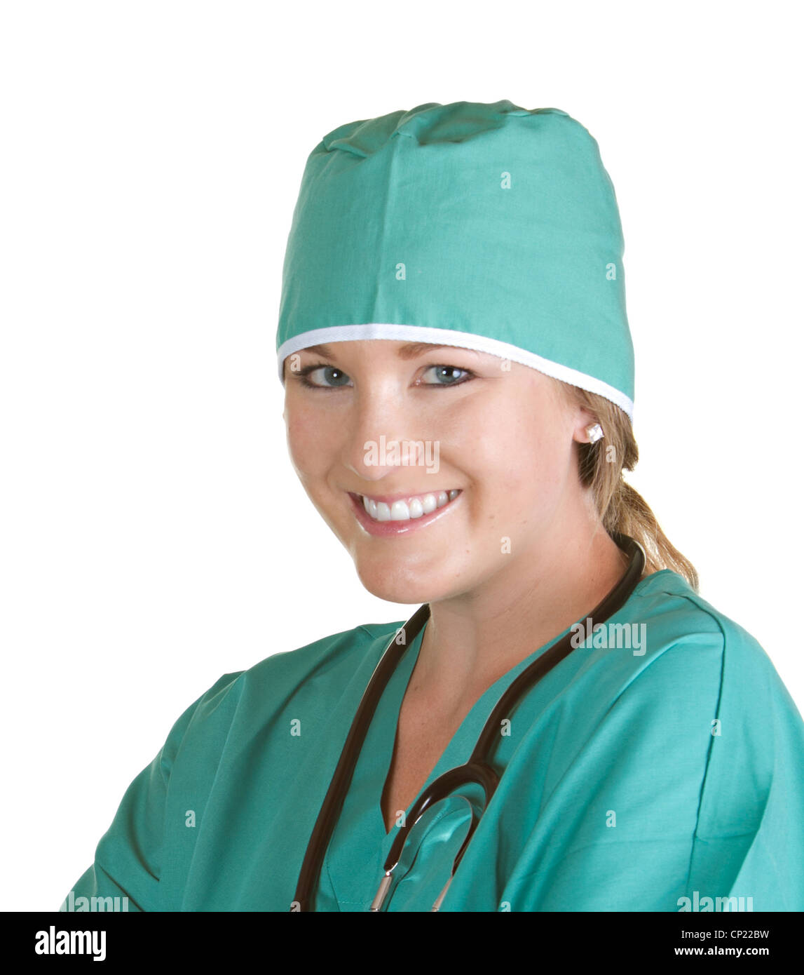 Smiling female nurse wearing green scrubs with surgical hat Stock Photo