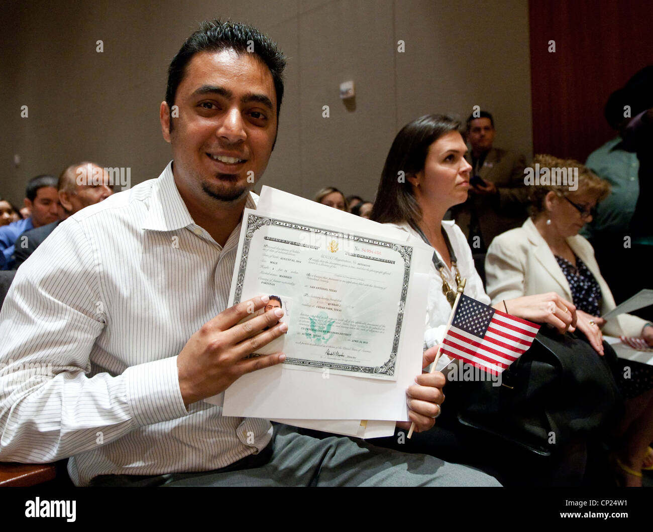Twenty-something young man from Pakistan become U.S citizens during a naturalization ceremony held in Austin, Texas Stock Photo