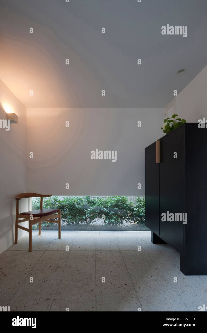 House in Musashiseki, Private House, Room with stone flooring and low-level window Stock Photo