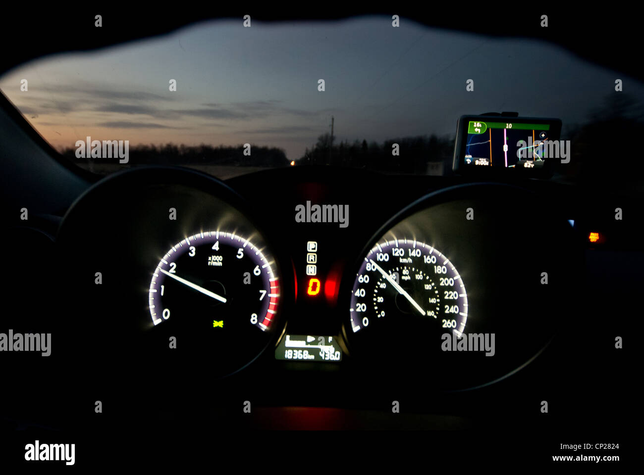 Dashboard gauges of a car while driving at night Stock Photo Alamy