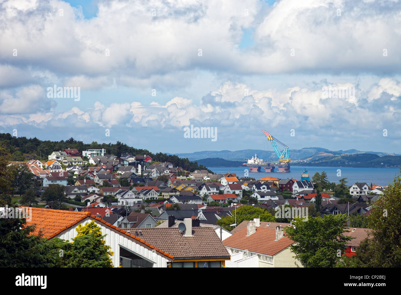 A large floating crane and Norwegian landscapes. Stock Photo
