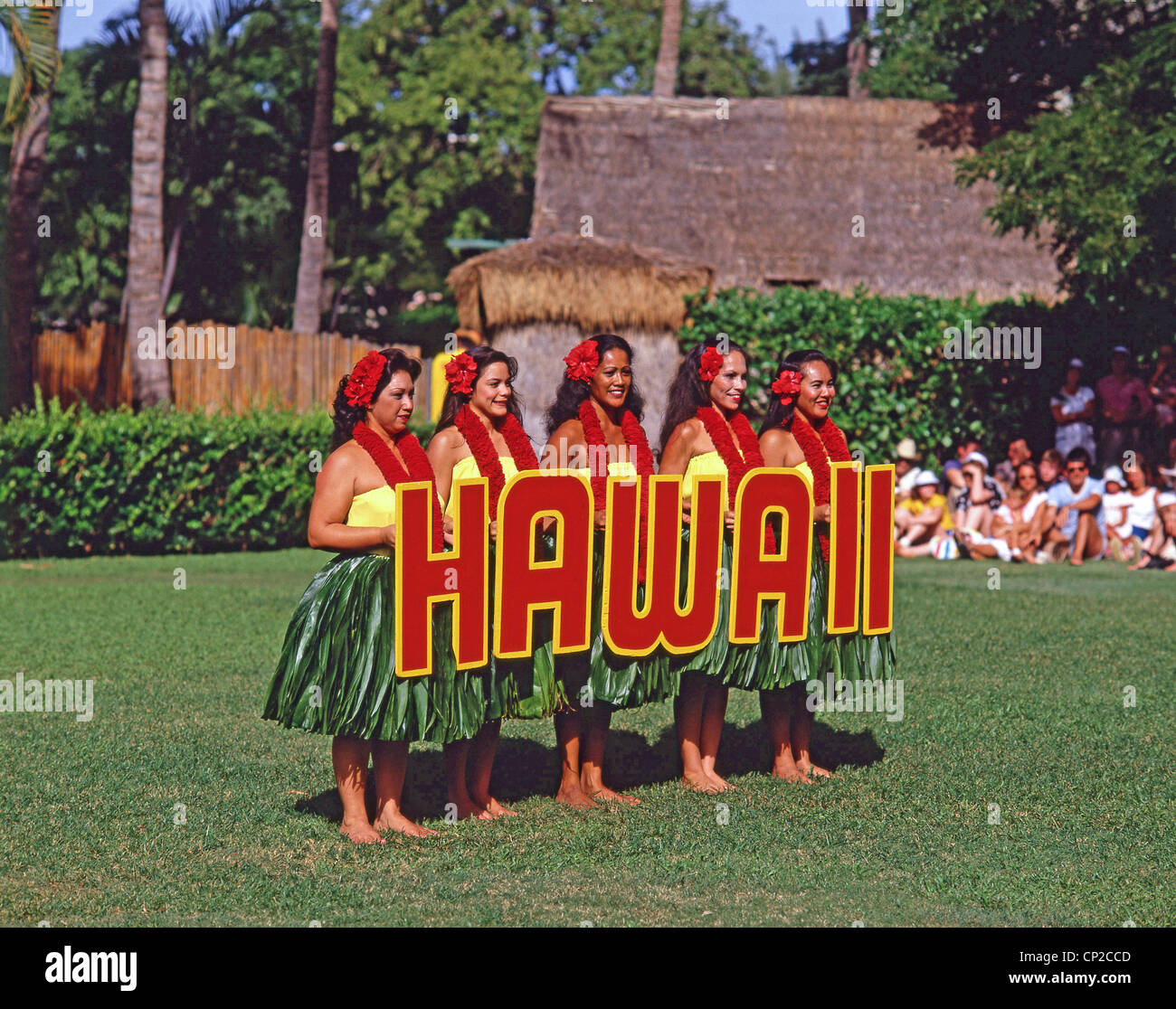 Hawaiian dancers holding 'Hawaii' sign, Kodak Hula Show, Honolulu, Oahu, Hawaii, United States of America Stock Photo