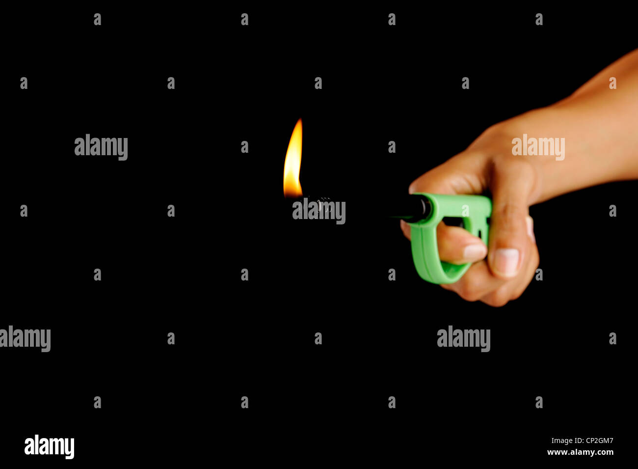 Hand holds gas lighter Stock Photo