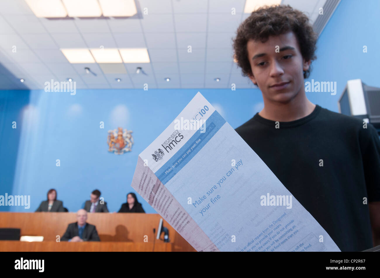 A defendant being advised how to pay a fine after being found guilty in a Magistrates Court Stock Photo
