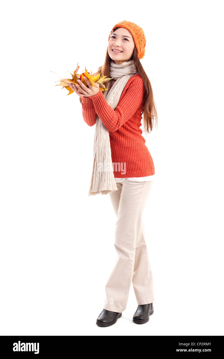 Young woman holding maple leaves Stock Photo - Alamy