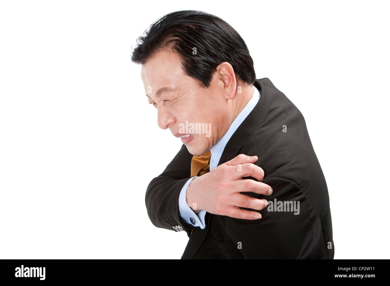 Senior businessman suffering from pain on shoulder Stock Photo - Alamy