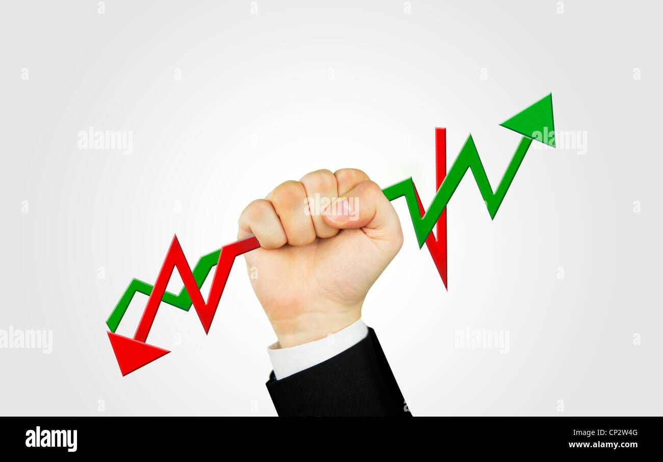 A man's holding the green and red chart arrows Stock Photo - Alamy