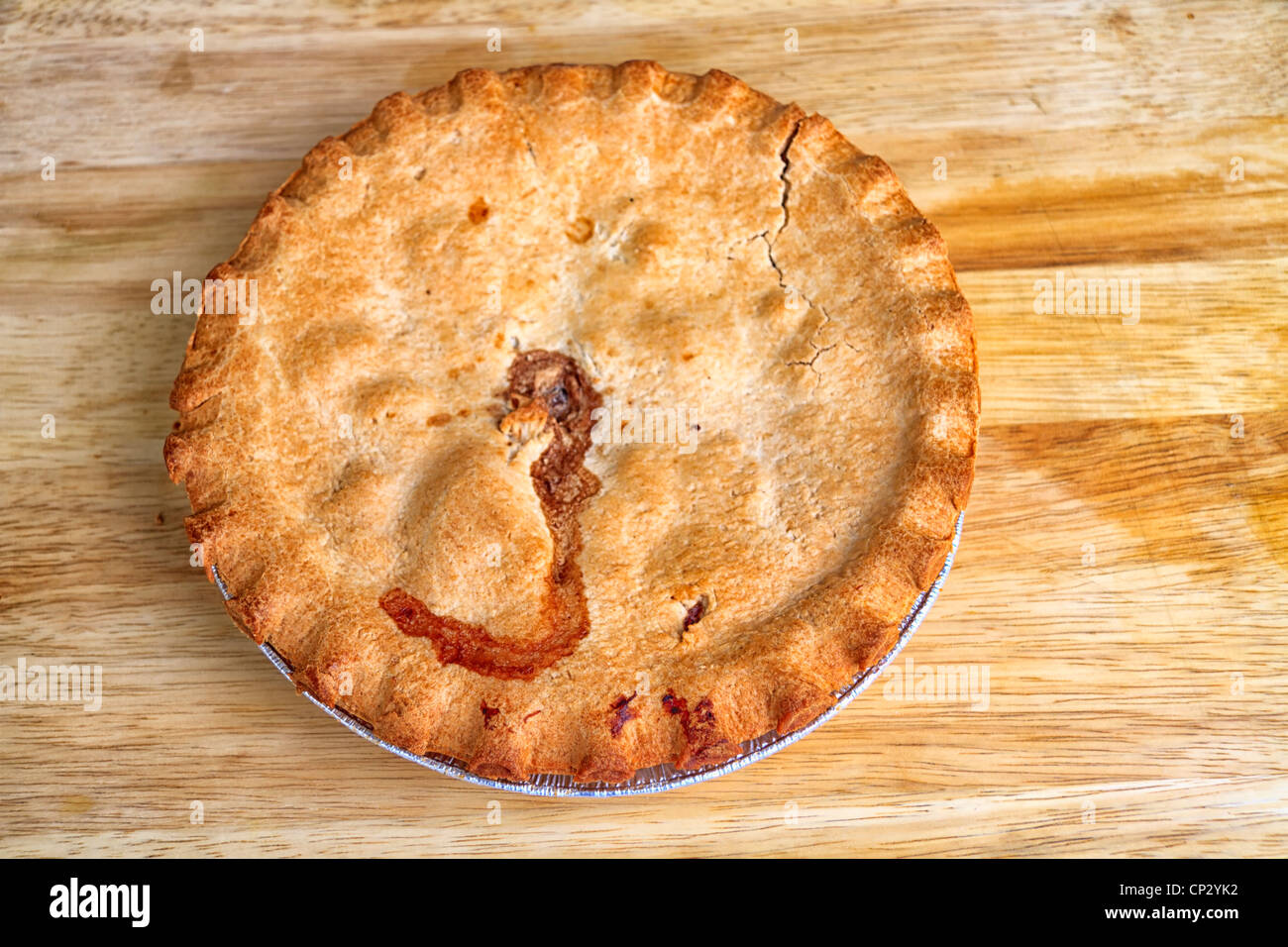 Cooked pie on a wooden board Stock Photo
