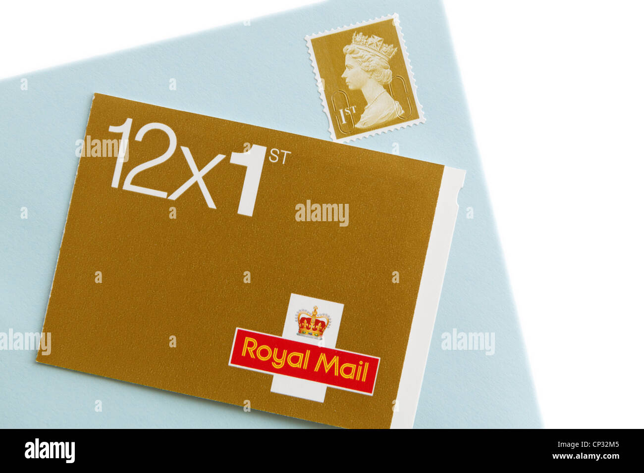 Book of twelve Royal Mail first class postage stamps and an envelope