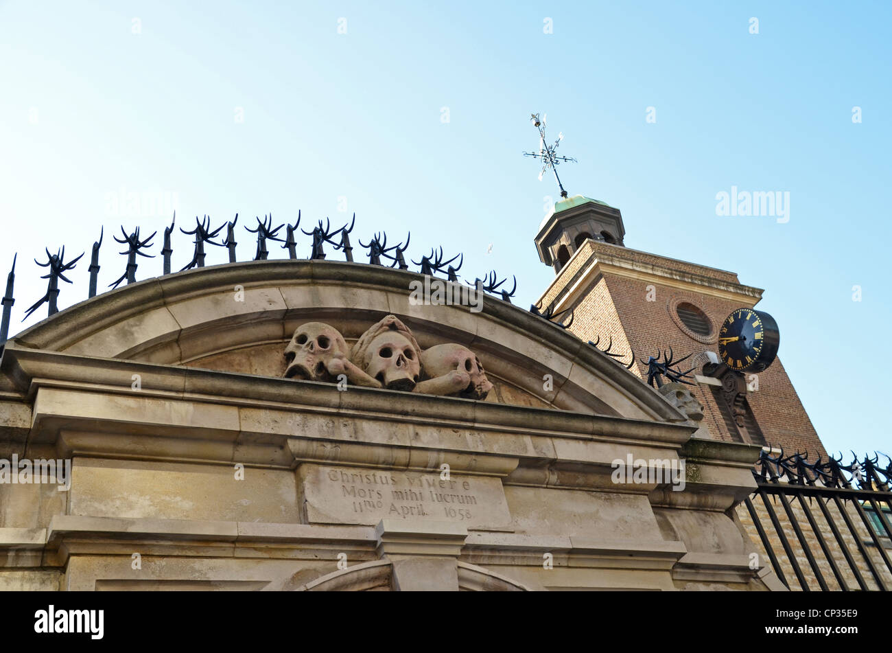 Skulls atop the gate entrance St Olave's Church, London Stock Photo