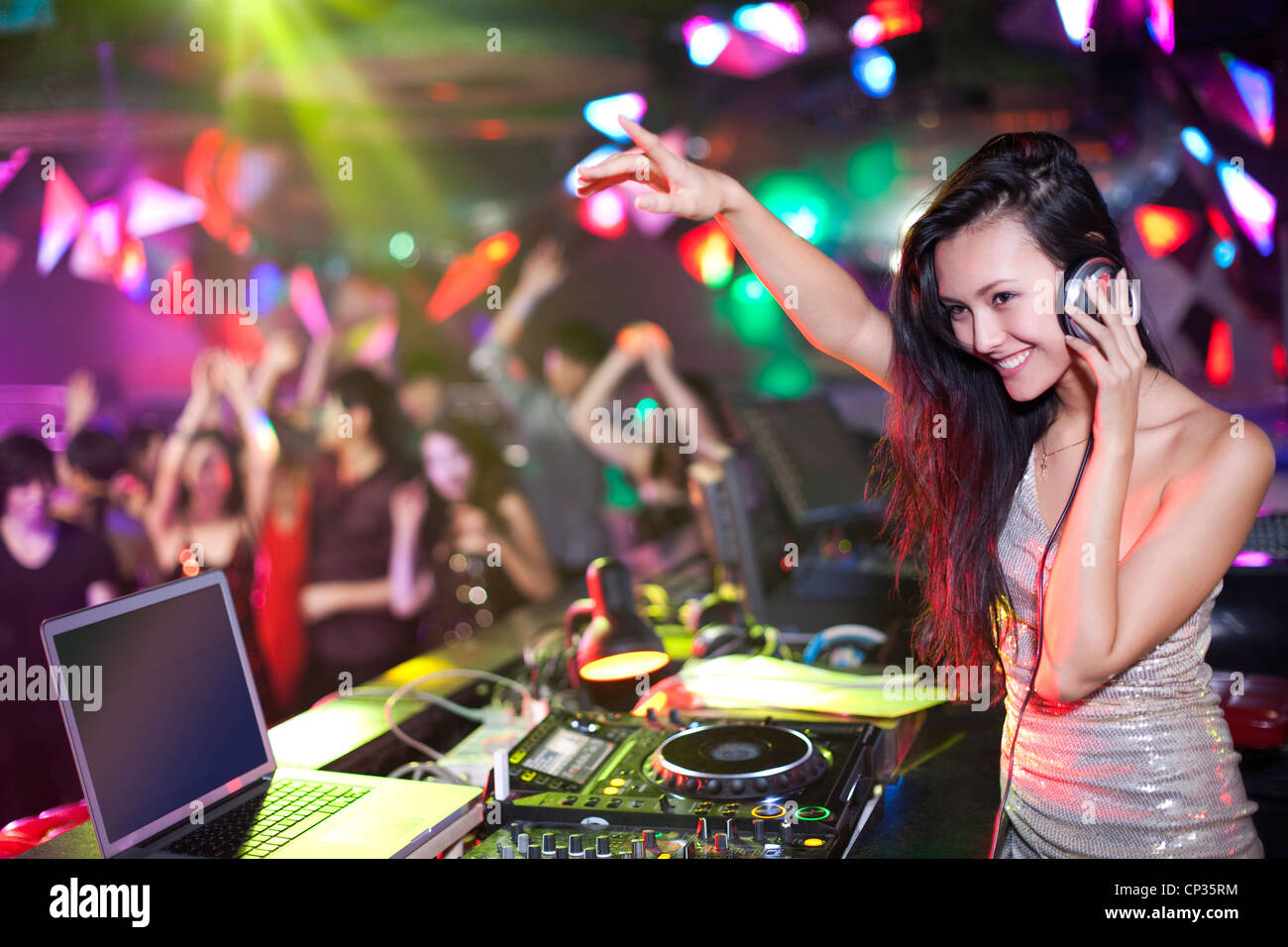 DJ doing record Scratching in nightclub Stock Photo - Alamy