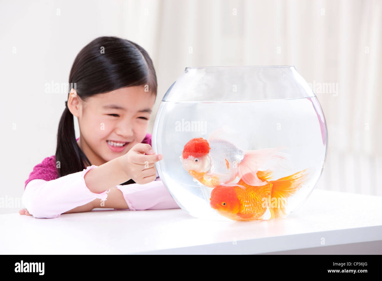 Chinese girl child fish hi-res stock photography and images - Alamy