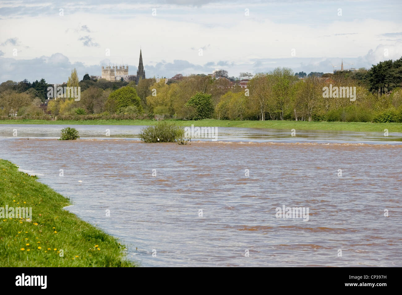 The River Exe overflowing into Exeter's flood relief and breaking the banks of the Quay following heavy rain. Stock Photo