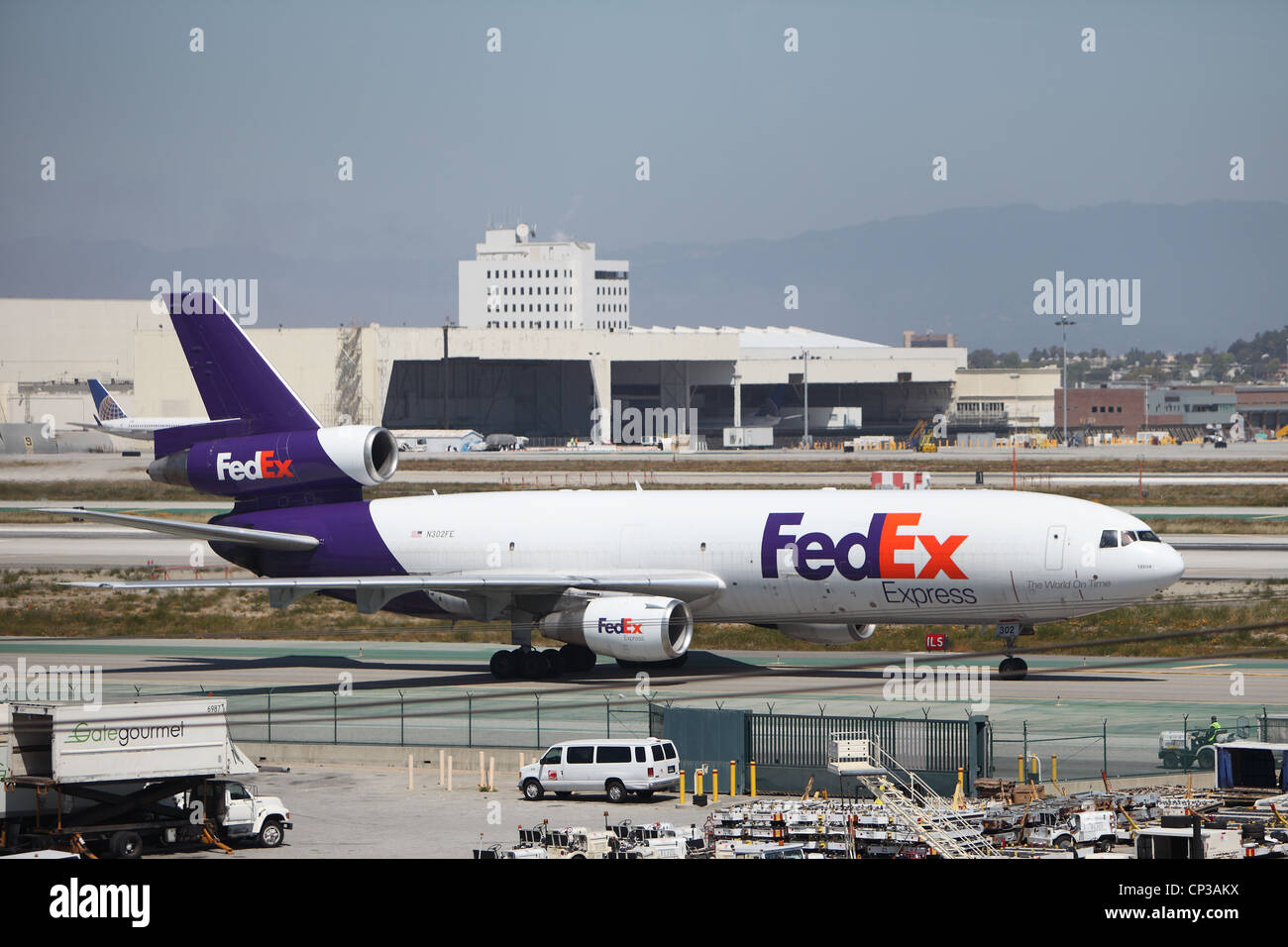A FEDEX MD-10 cargo plane taxis to the terminal at Los Angeles Airport on April 15, 2012. The plane was upgraded from a DC-10 Stock Photo