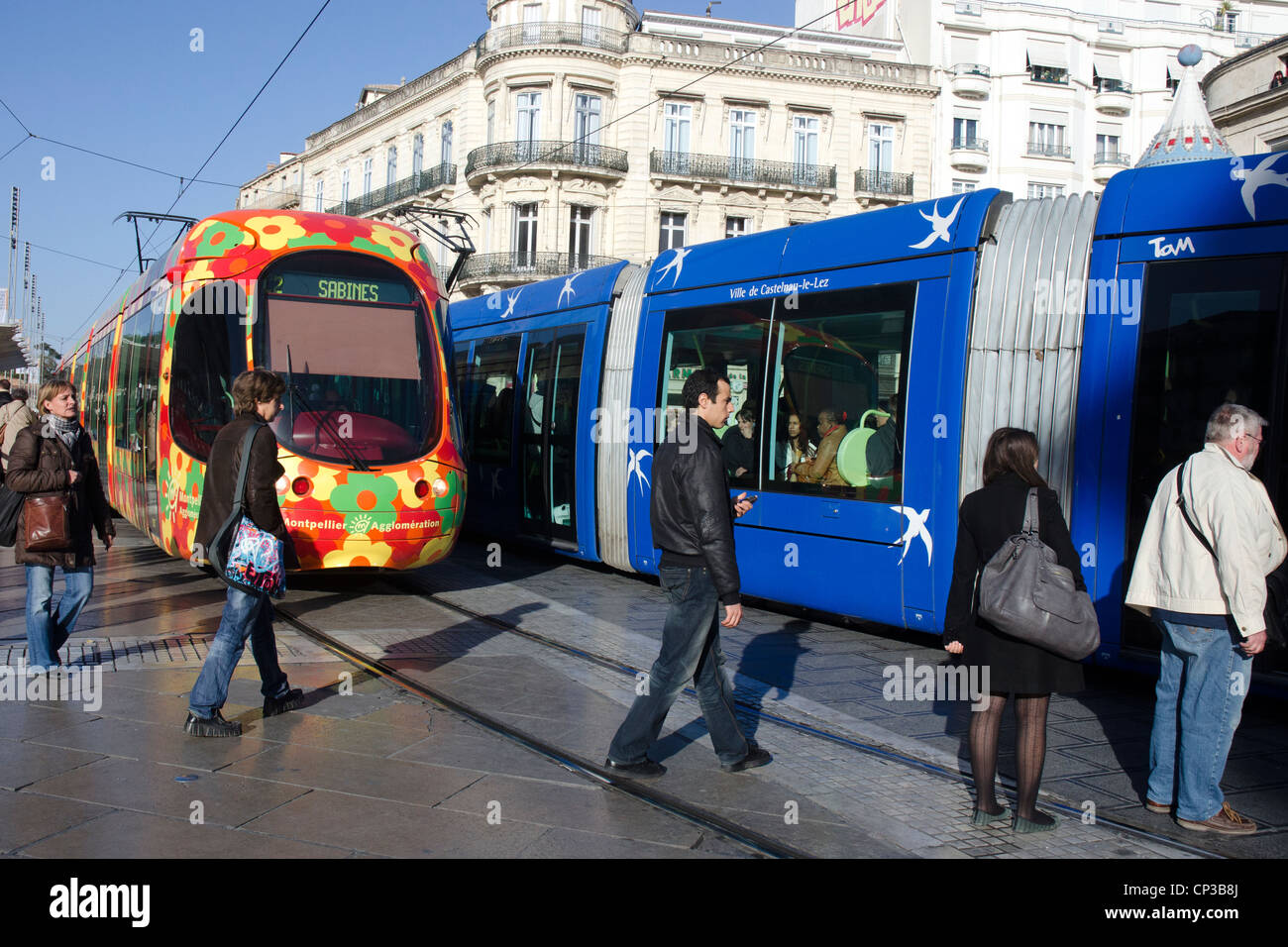 Streetcars - trams - from two different lines crossing in the center of Montpellier, France. Stock Photo
