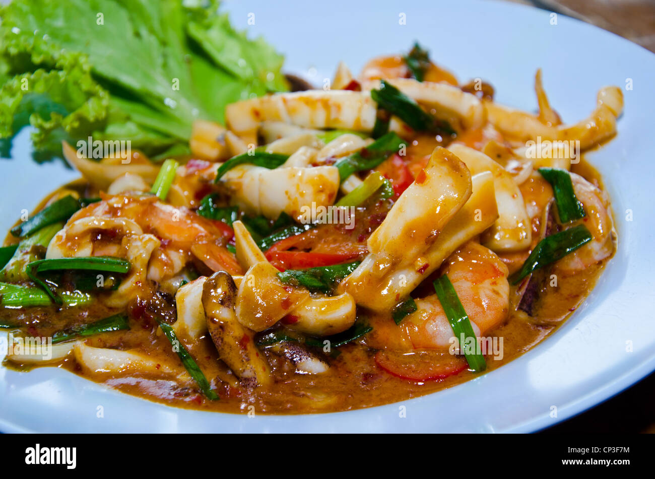 Stir-fried chilli squid with spicy Stock Photo - Alamy