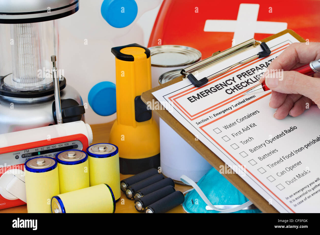 Hand completing Emergency Preparation List by Equipment Stock Photo Alamy