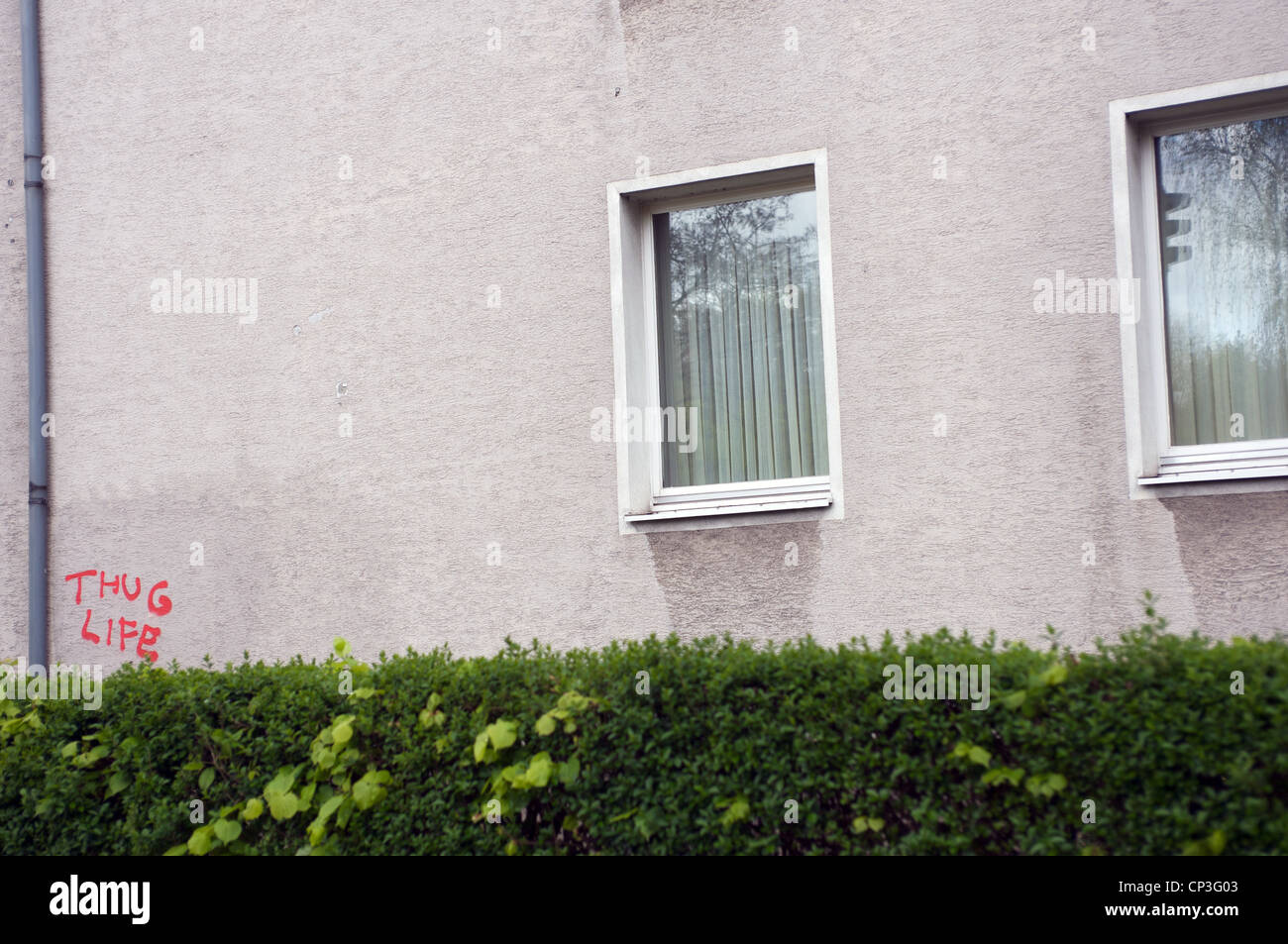 'Thug Life' graffiti spray painted on apartment block Stock Photo