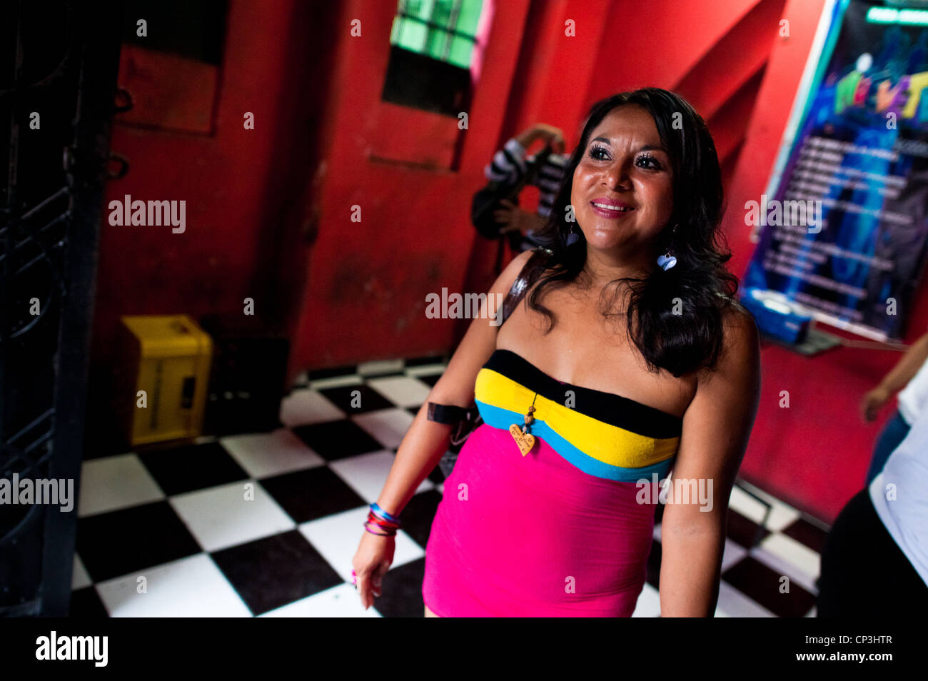 A Salvadorean girl, working as a prostitute, leaves a discotheque in San Salvador, El Salvador Stock Photo
