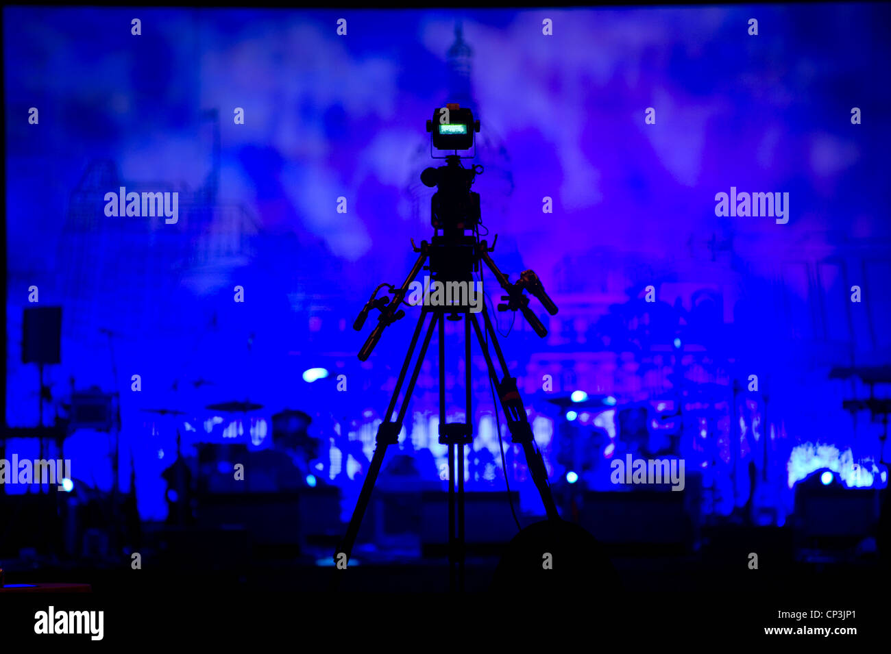 Tripod and camera stand tall to overlook the stage. Stock Photo