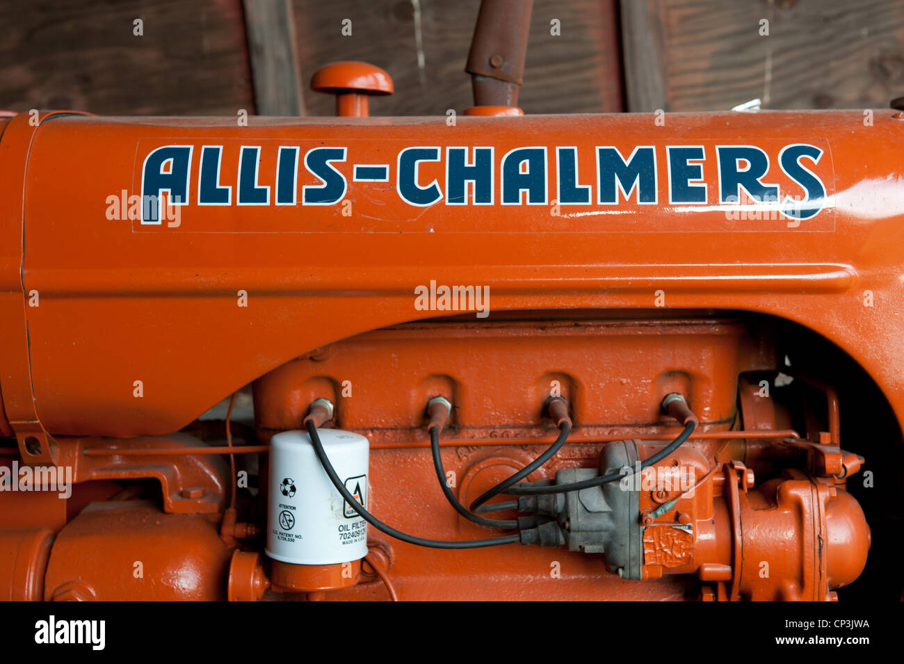Vintage orange tractor Stock Photo