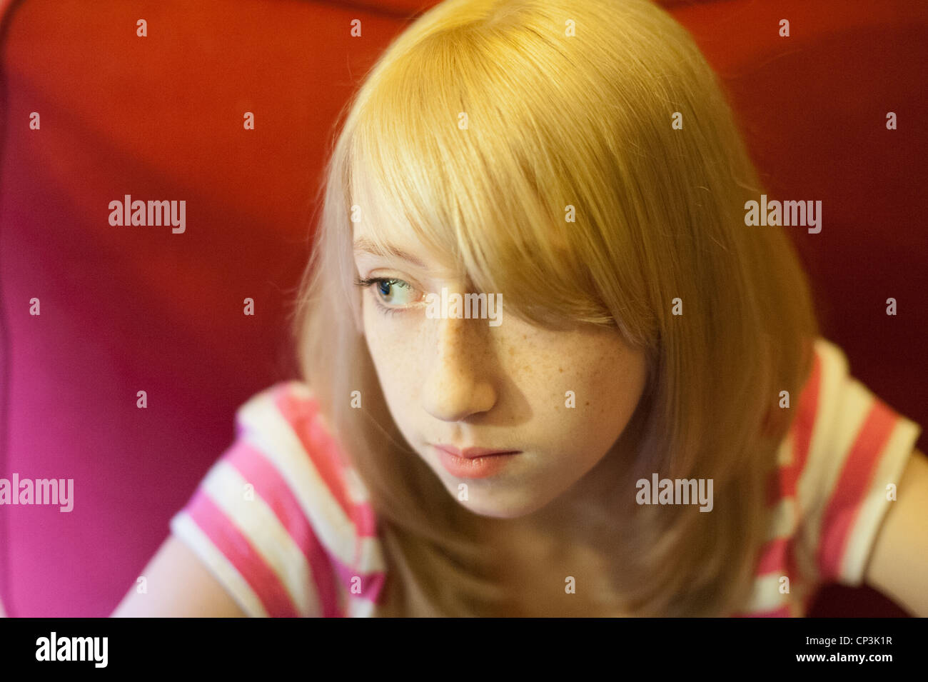 Teenage girl with bleach blonde hair Stock Photo