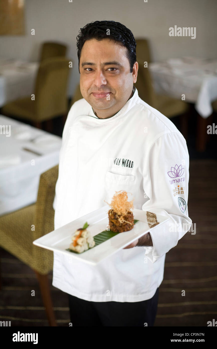 Chef Manish Mehrotra with a dish of duck chettinad and umpa barrels at the Indian Accent restaurant, New Delhi, India Stock Photo