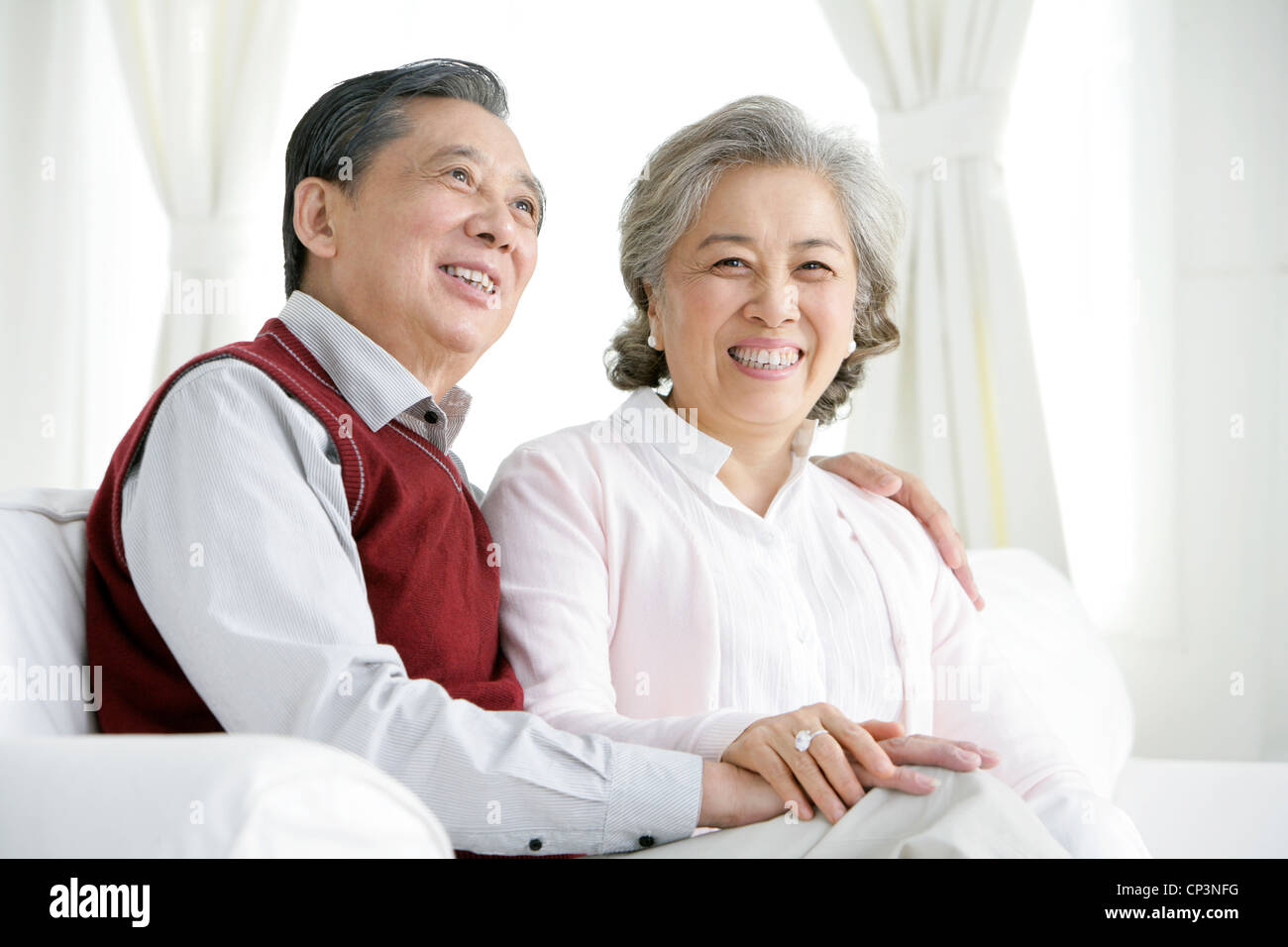Senior Chinese couple in living room Stock Photo - Alamy