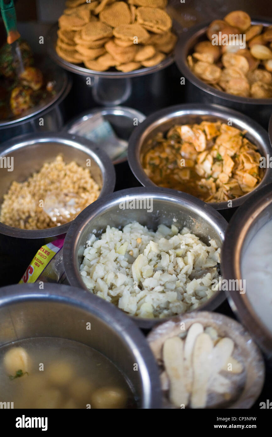 Pots of chat (street food snacks) at the Ashok Chat Corner in Chawri Bazaar, Old Delhi India Stock Photo