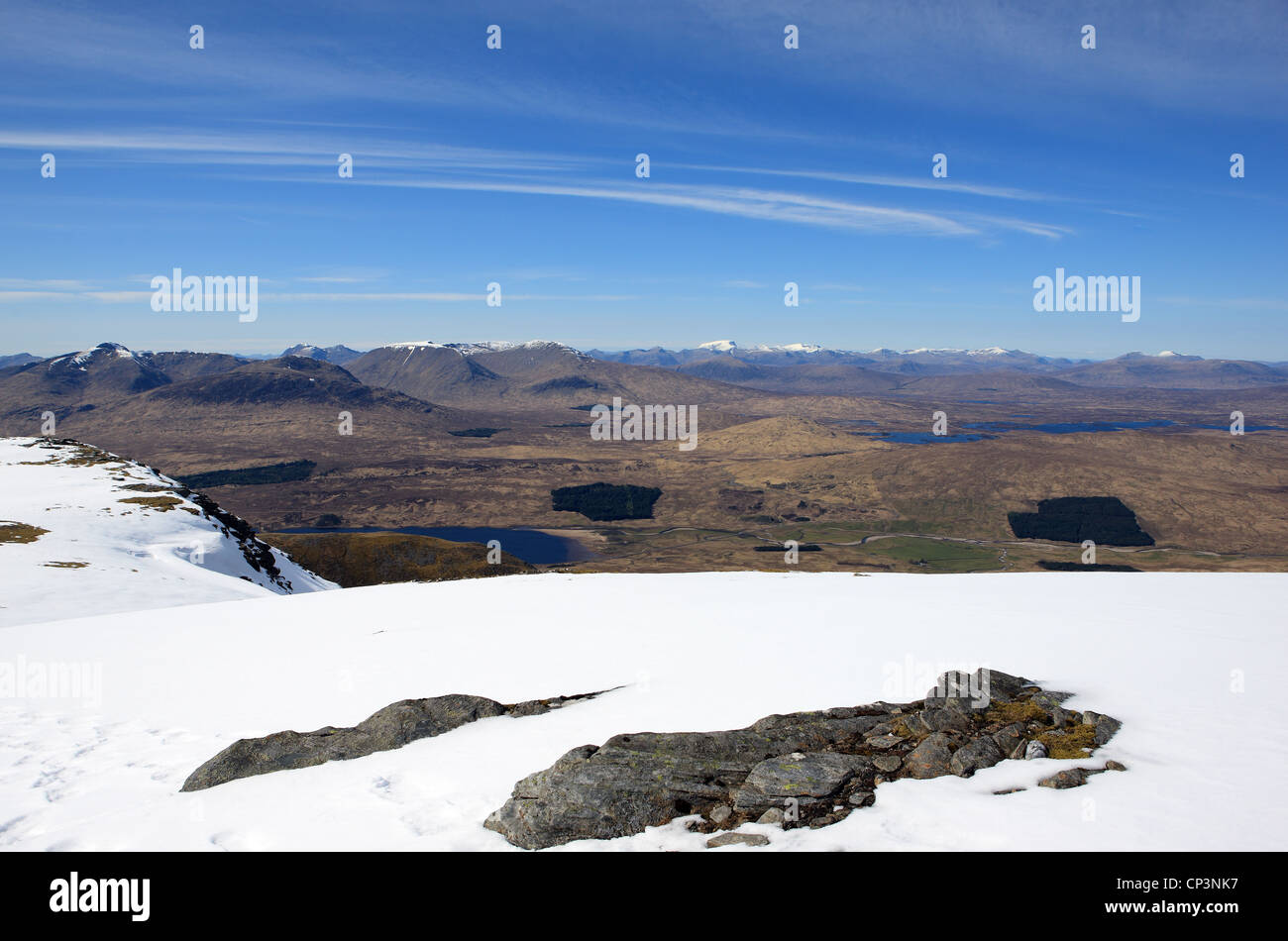 View form the snow covered top of Beinn an Dothaidh at Bridge of Orchy over Rannoch Moor and the north end of Loch Tulla below Stock Photo