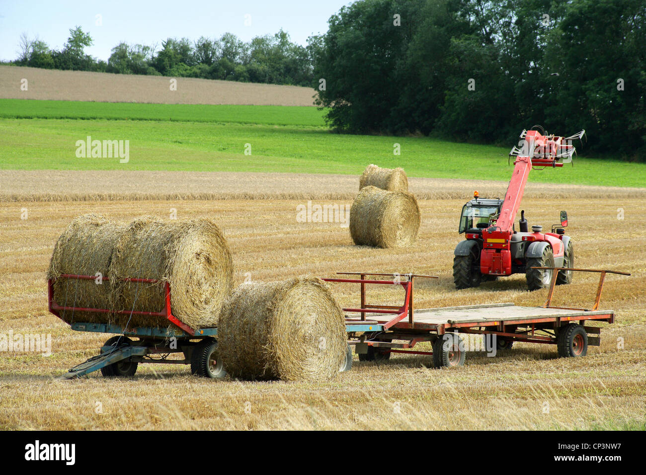 Tractor and trailer baling hay hi-res stock photography and images - Alamy