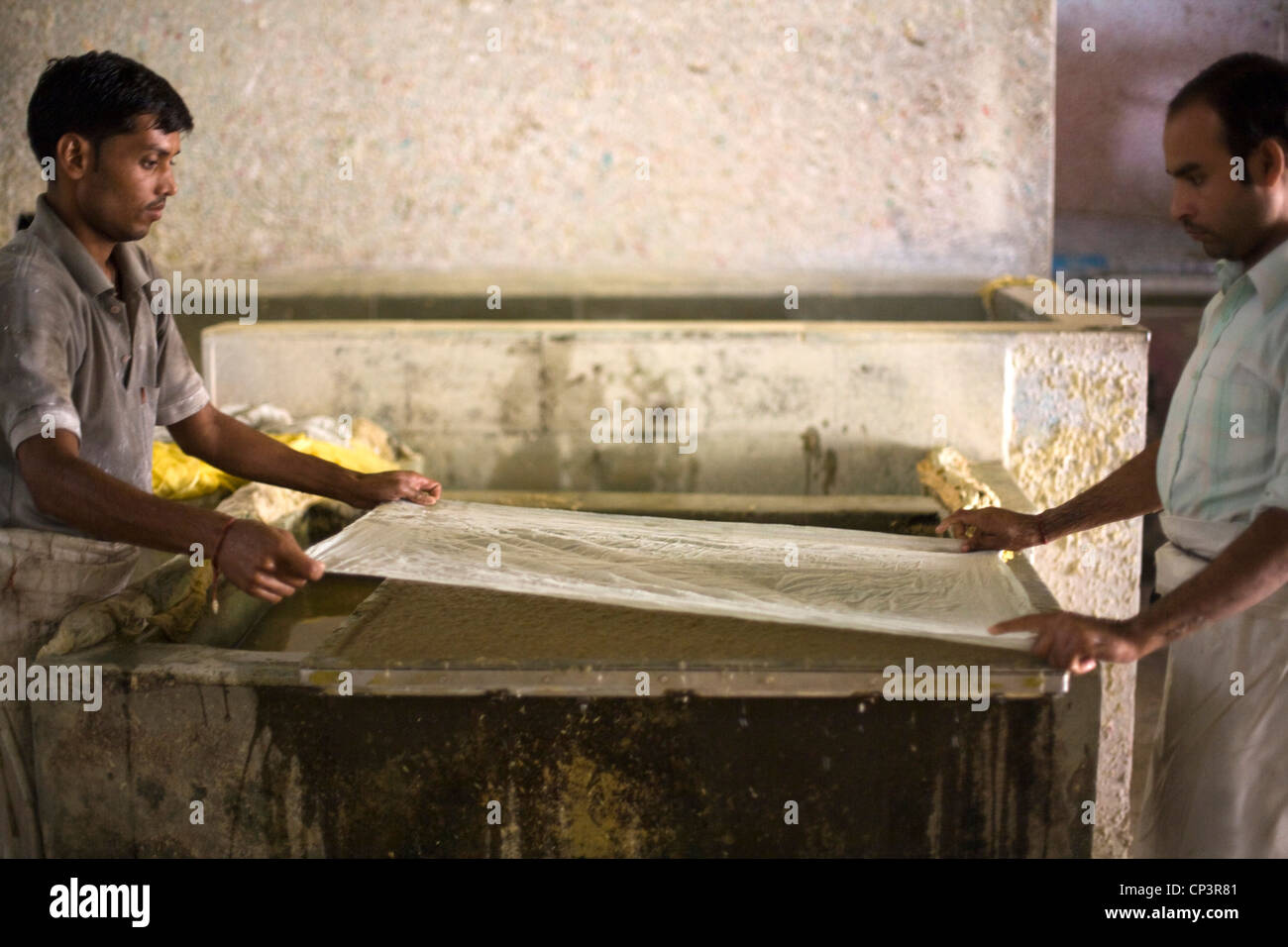 Workers making paper by hand at a factory in sanganer jaipur india