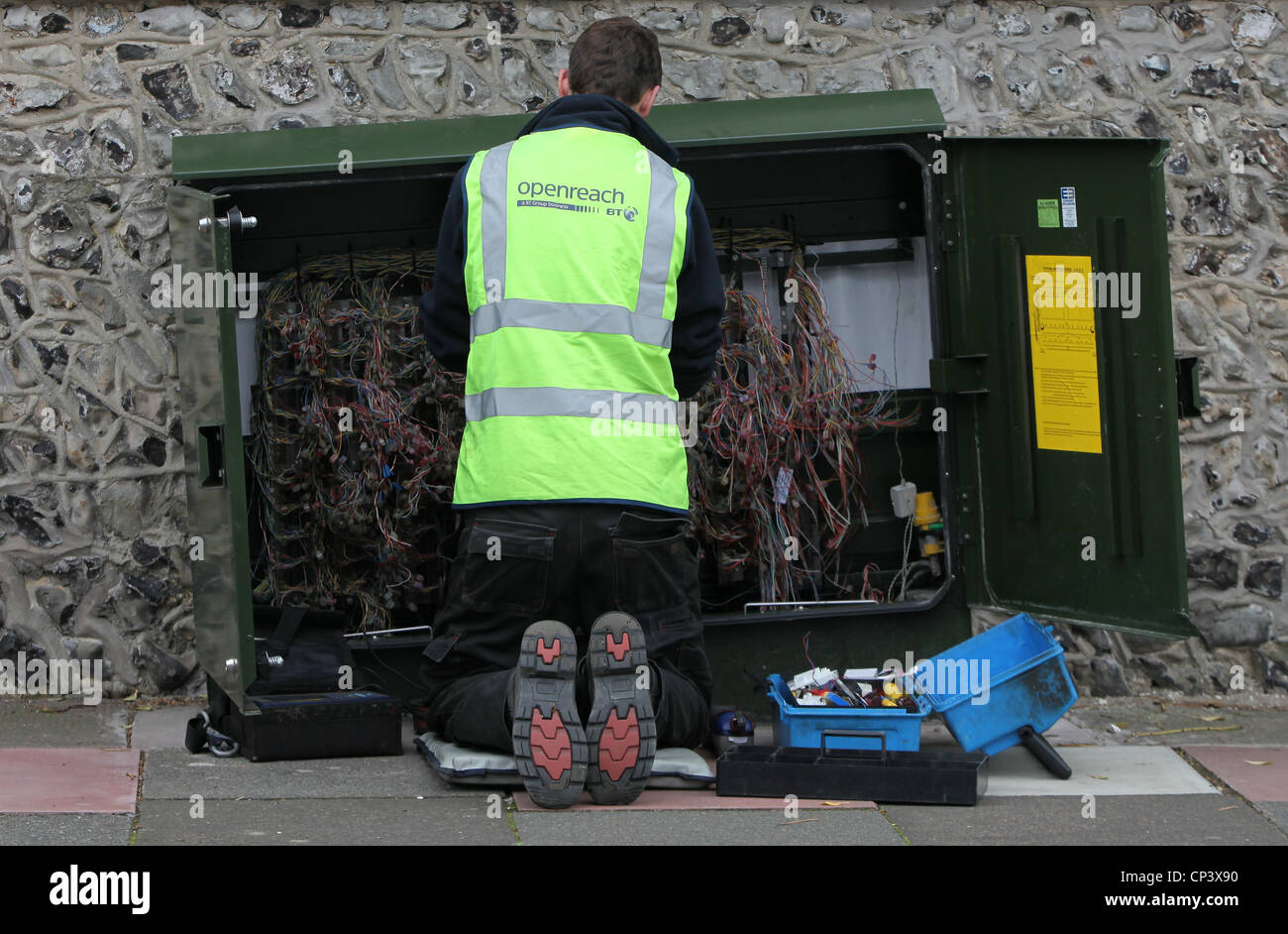 BT Openreach telephone engineer working on residential phone lines. Stock Photo