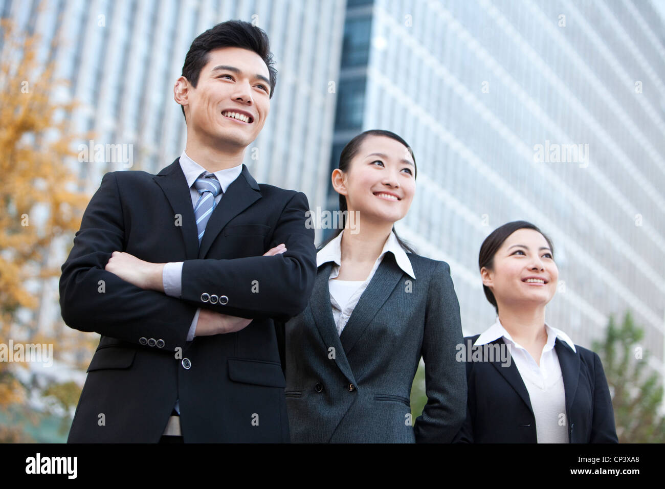 A team of businesspeople outside office buildings Stock Photo - Alamy