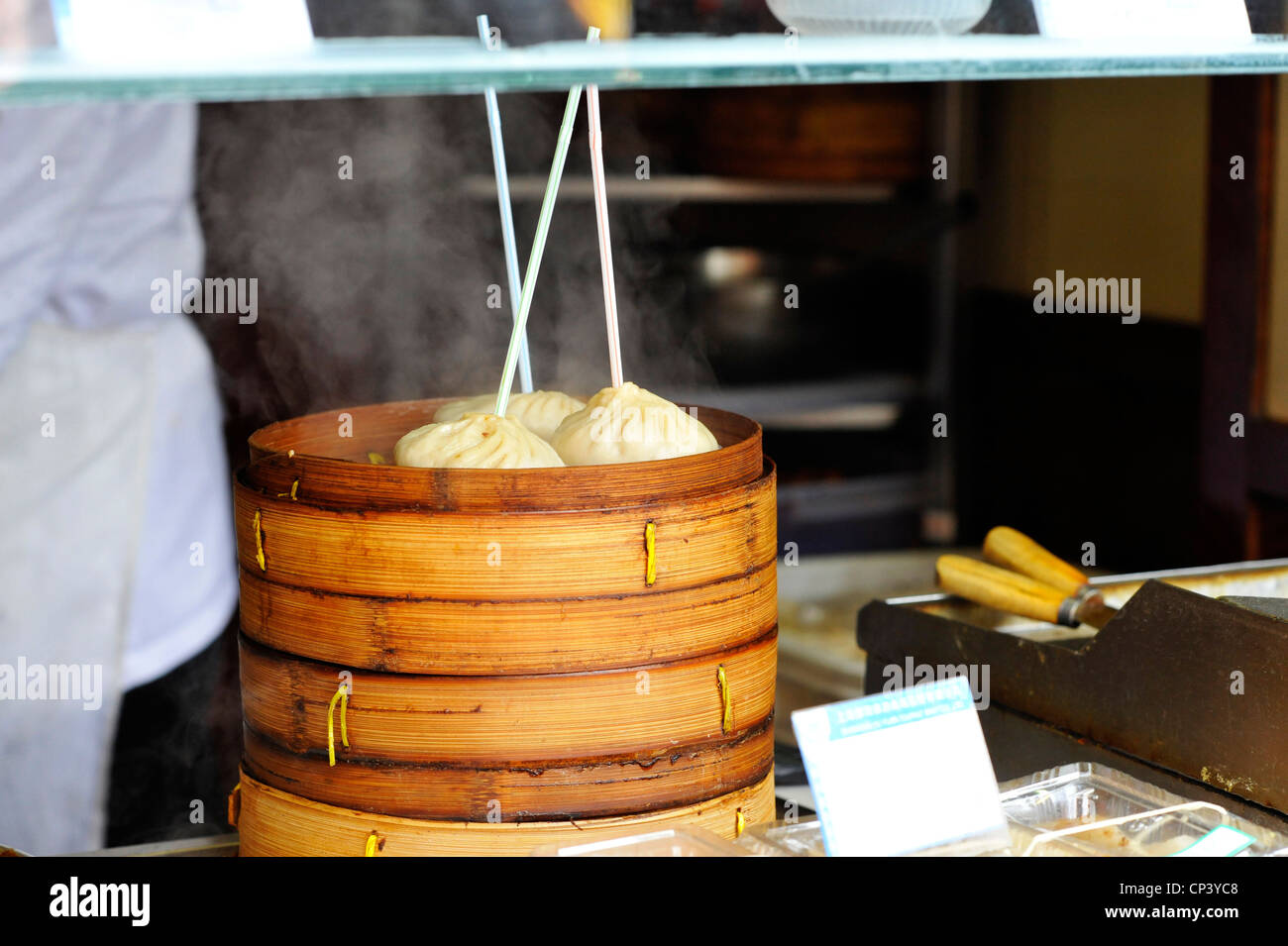 Steamed dumplings cooking in tradtional bamboo steamers in Shanghai