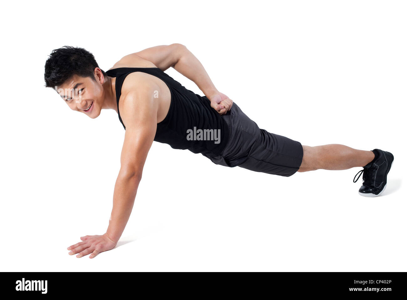 Man doing one-handed push-ups Stock Photo