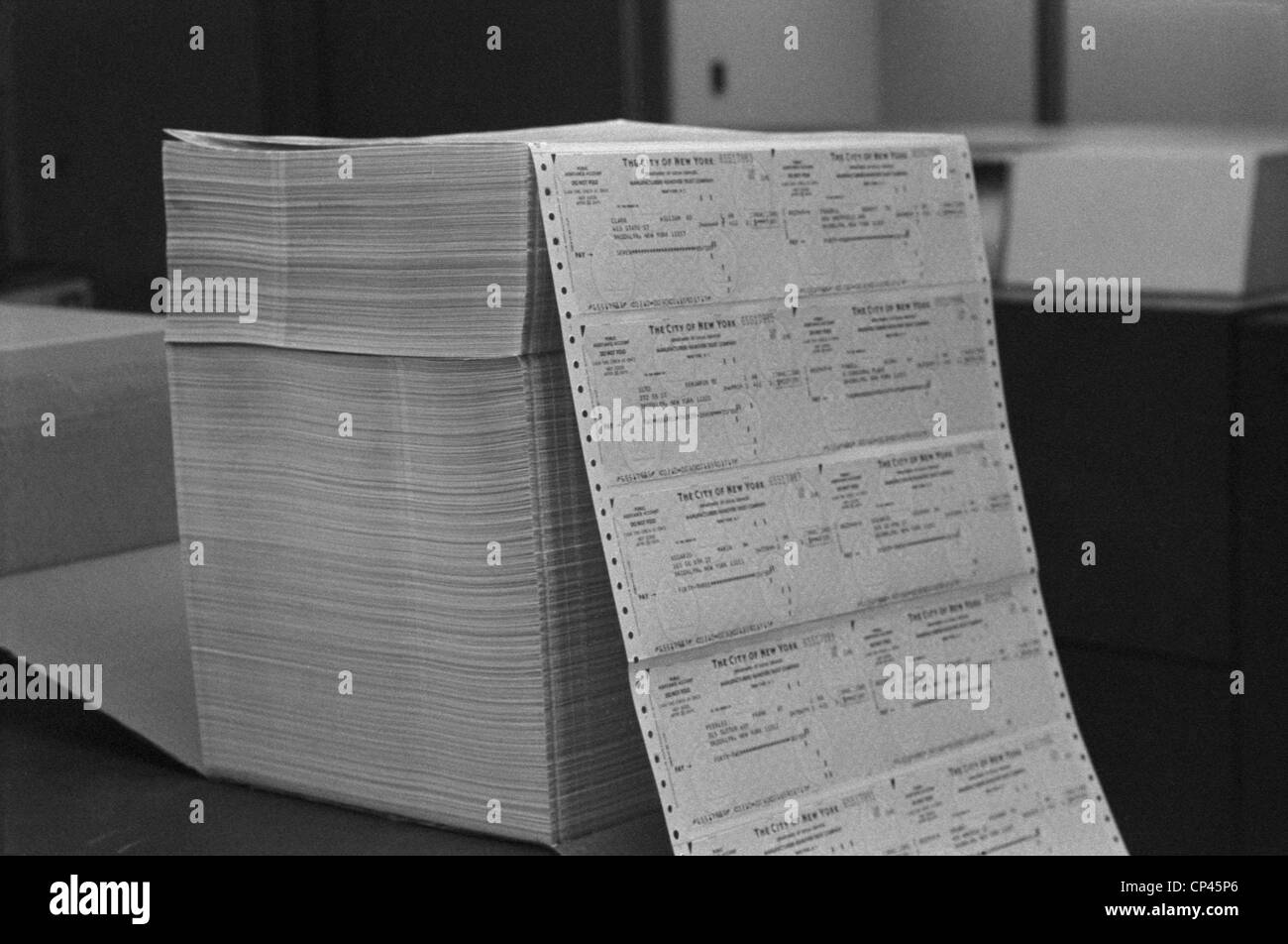 Large stack of computer generated welfare checks at a New York City welfare office. May 24 1976. Stock Photo