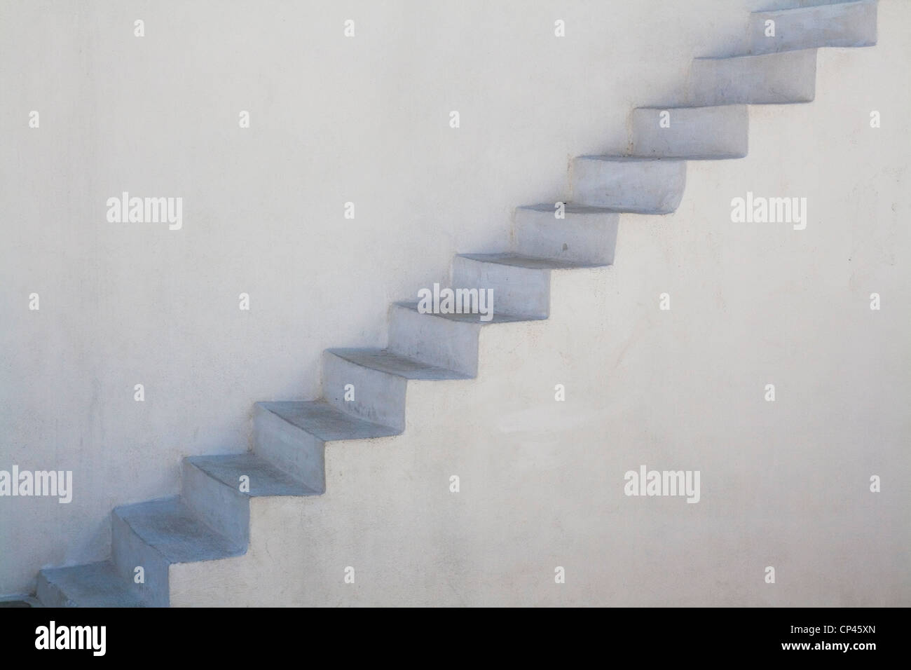 white stone steps flush against a wall Stock Photo Alamy
