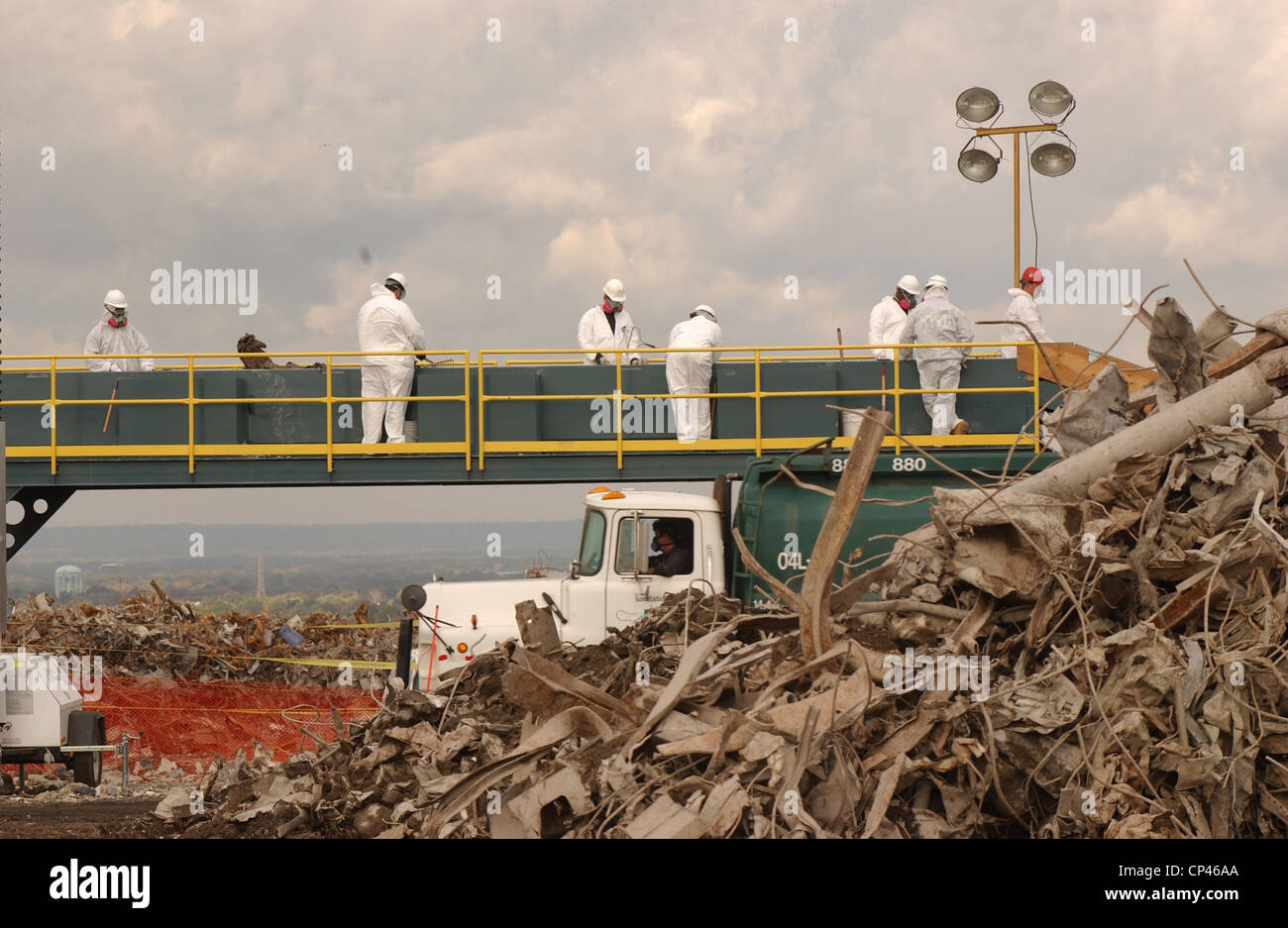 Workers at the Fresh Kills Landfill examine debris from the World Trade