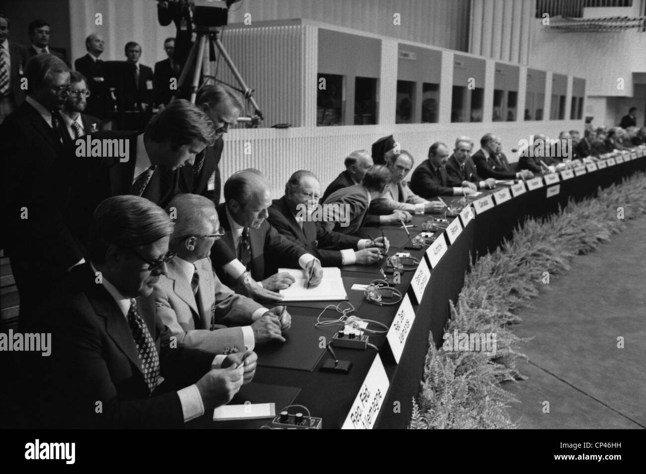 President Ford signs the Helsinki Accords with 35 other European