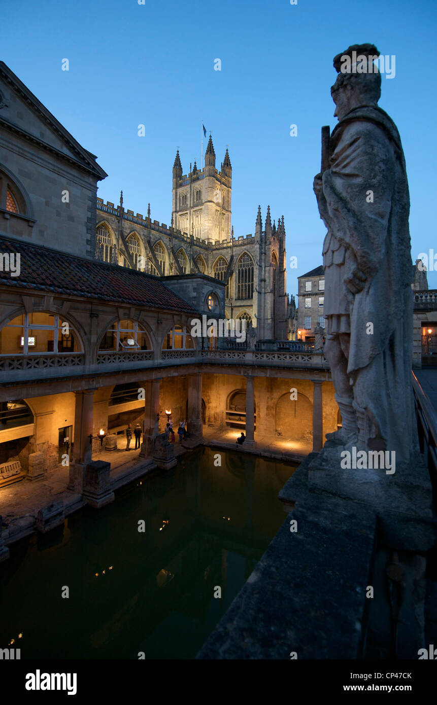 The Roman Baths at night with Abbey in background, Bath, UK Stock Photo