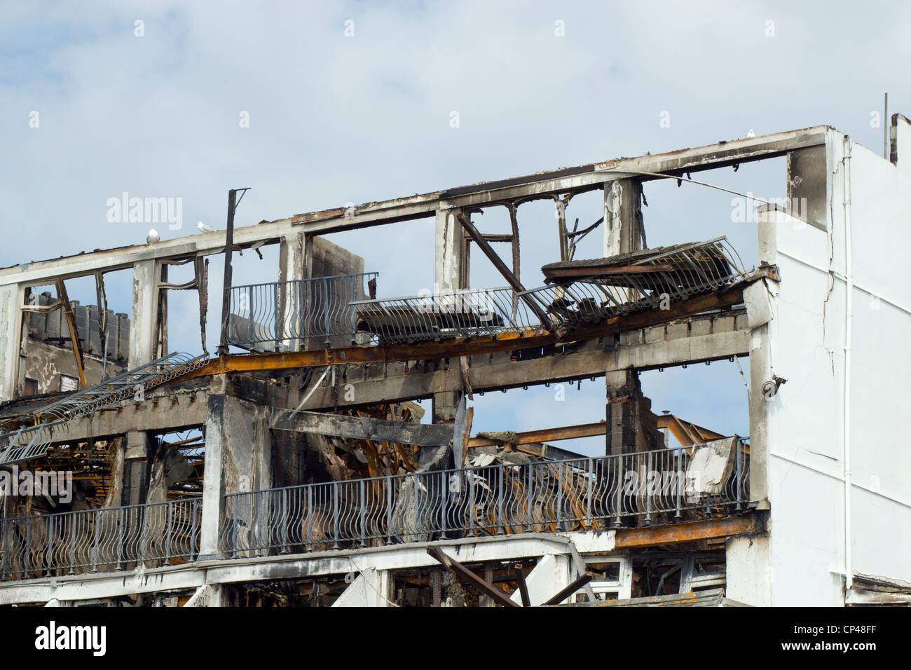 Close up burnt out remains of the Best Western Falmouth Beach Resort